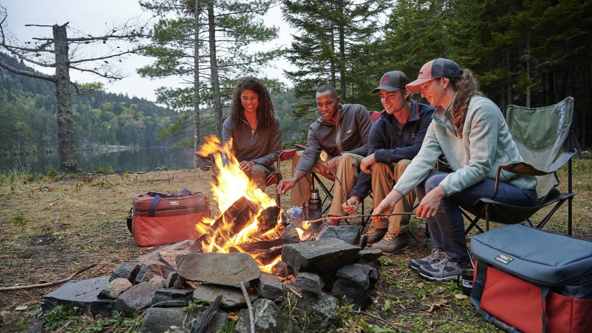An image of people gathered around a campfire tied to L.L.Bean's "off the grid" announcement surrounding Mental Health Awareness Month.