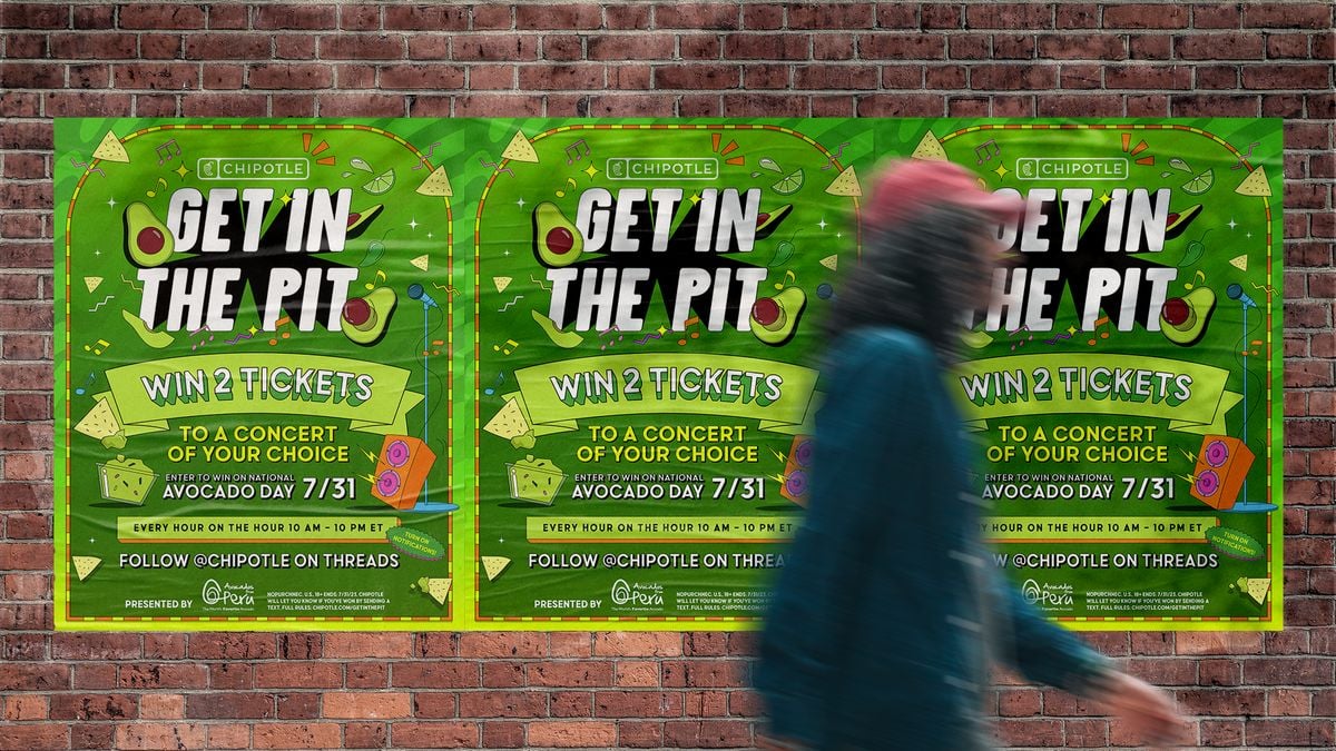 Chipotle's "Get in the Pit" campaign image, shown as a poster on a busy sidewalk, timed to National Avocado Day.
