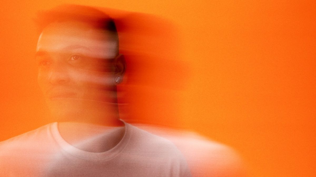 A blurry photo of Felipe Nunes against an orange background for Vans' new ad campaign.